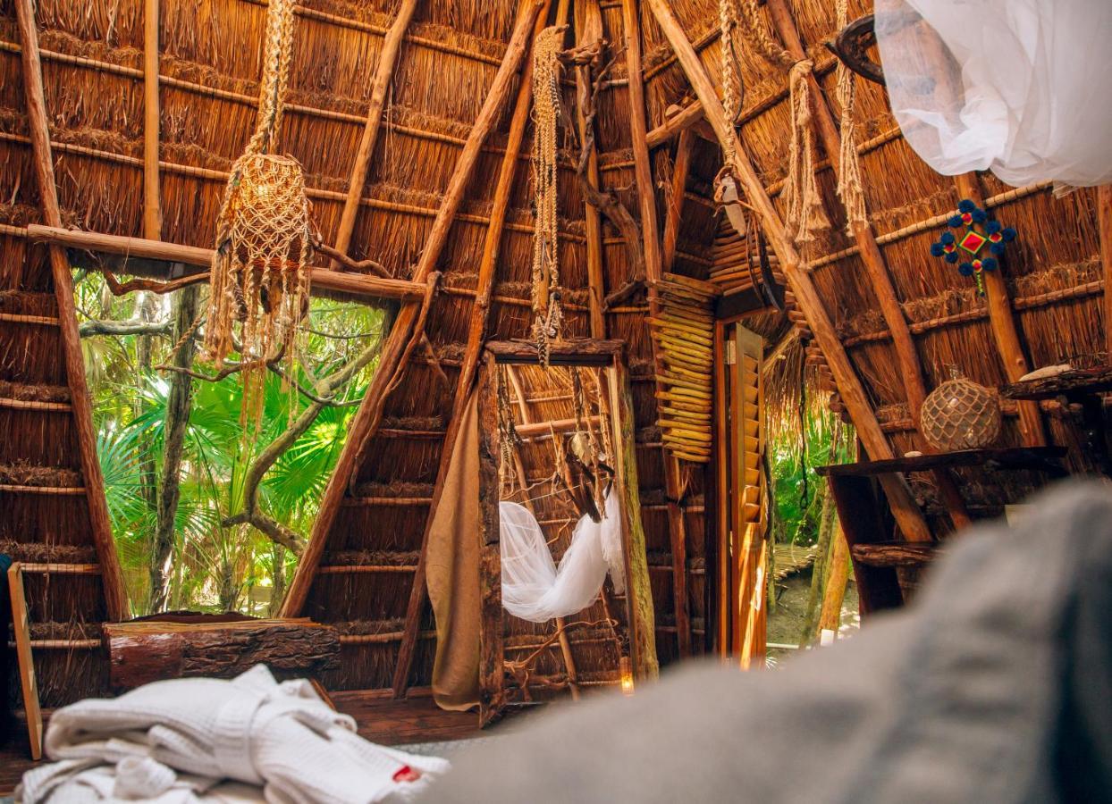 Ikal Tulum Hotel Exterior foto Interior of a hut at the resort